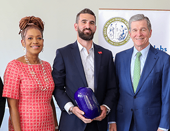 (L-R) Commerce Secretary Sanders; IONNA CEO Seth Cutler; and Governor Cooper earlier today in Durham at the IONNA announcement.