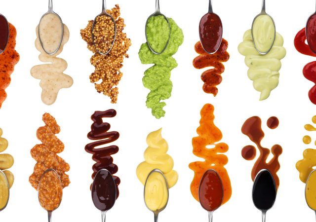 Different sauces isolated on white background