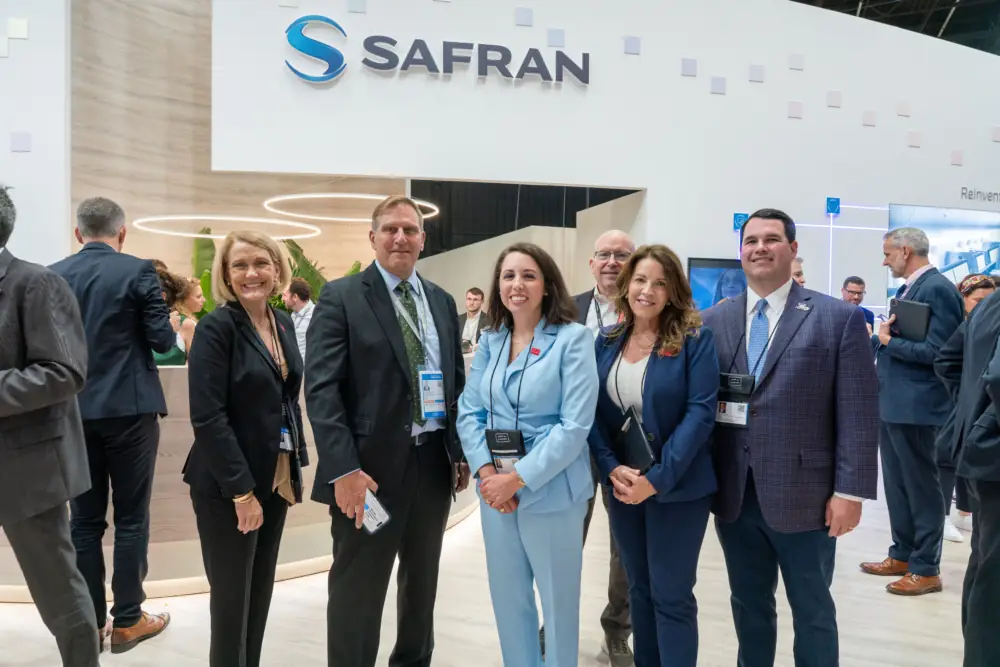 The Alabama team at the 2025 Paris Air Show visits the exhibition space of French aerospace company Safran. (Image: Safran)